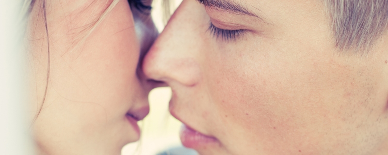 Close up of a couple about to kiss.